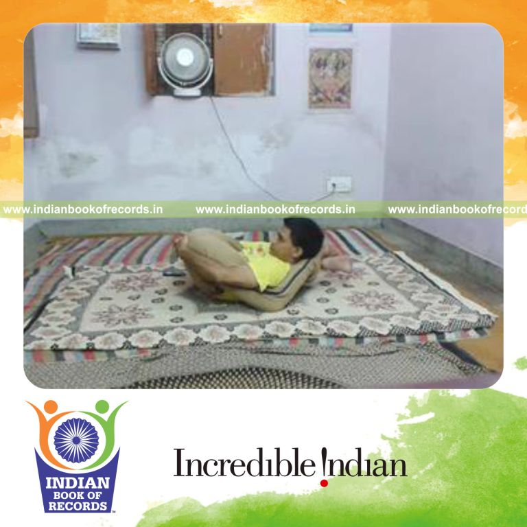 individual holding legs behind head pose for longest time for record in Indian Book of Records