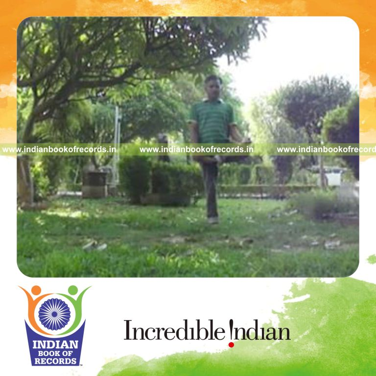 individual performing meditation pose while standing on one foot for record in Indian Book of Records