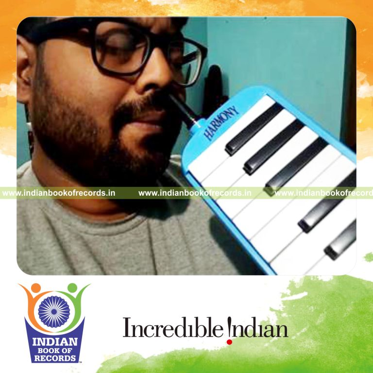 individual playing melodica with nose for longest duration for record in Indian Book of Records