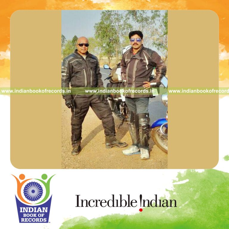 team completing long motorcycle journey within country for record in Indian Book of Records