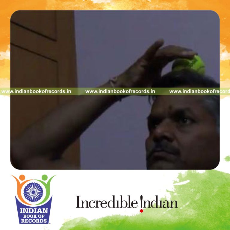individual moving cricket ball around top of head for record in Indian Book of Records