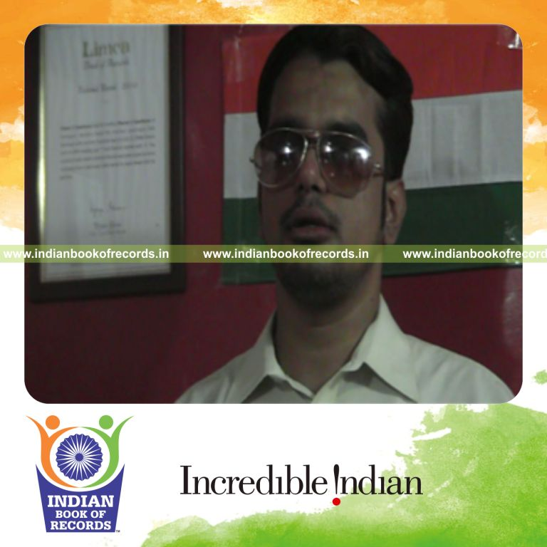 individual inserting longest nail inside nose for record in Indian Book of Records