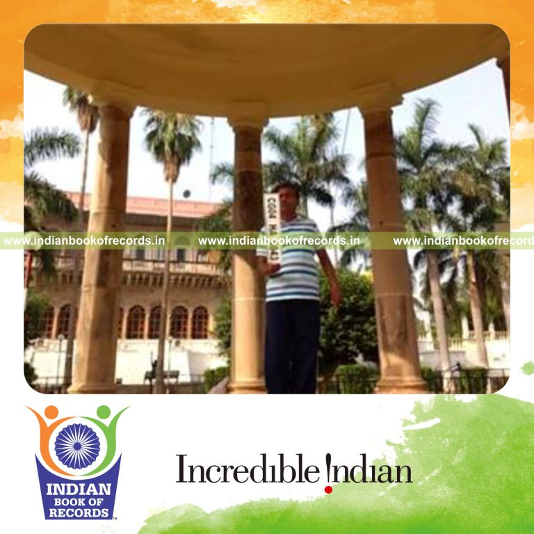 individual balancing car number plate on index finger for longest time for record in Indian Book of Records