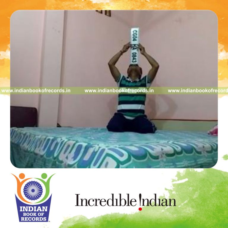 individual balancing car number plate on nose for longest duration for record in Indian Book of Records