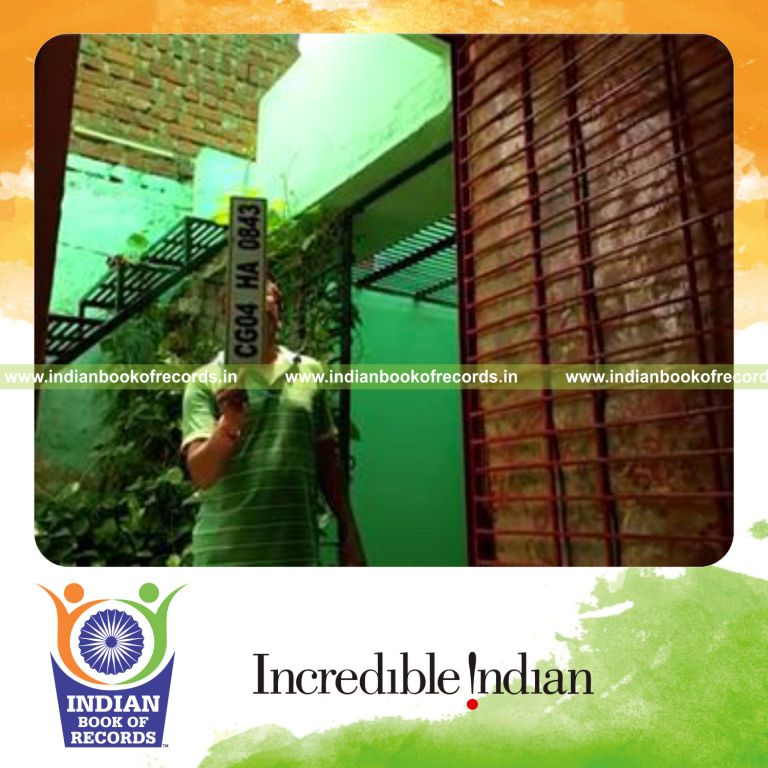individual balancing car number plate on thumb for longest time for record in Indian Book of Records