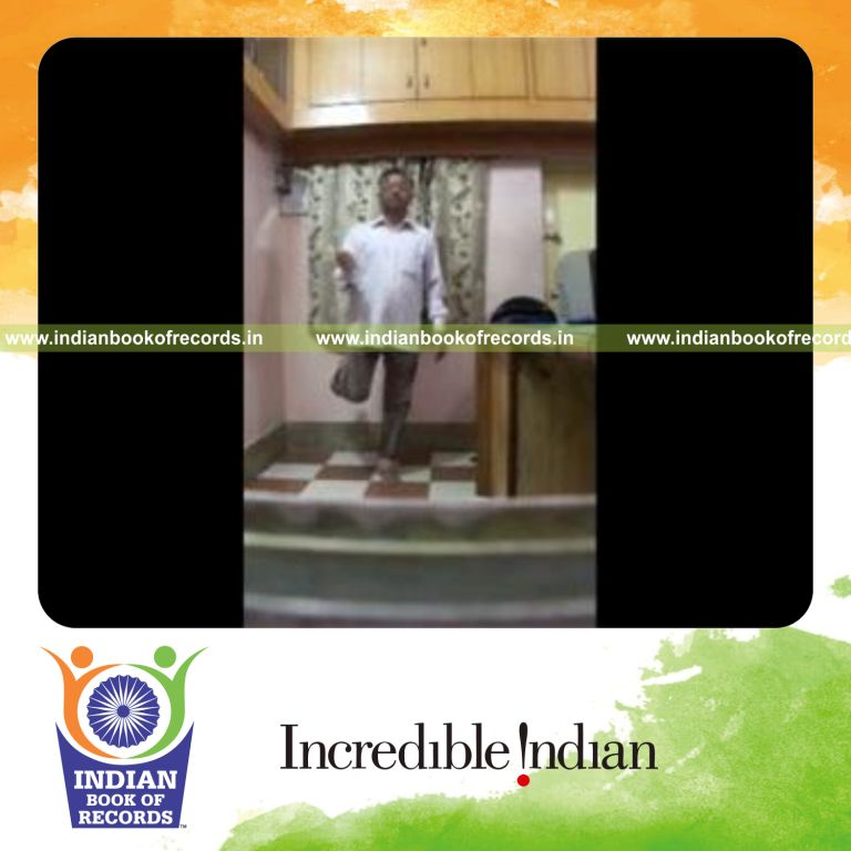 individual performing one handed poi spin while standing on one foot for record in Indian Book of Records