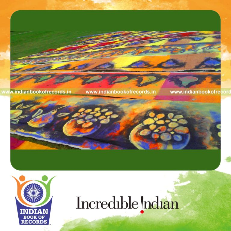 male individual creating extended painting artwork for an record in Indian Book of Records