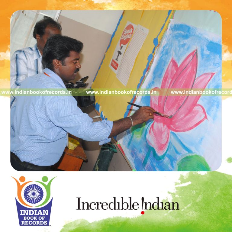 male individual creating extended painting artwork for record in Indian Book of Records