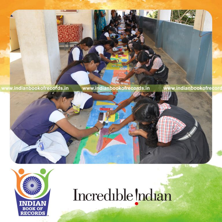 team of students creating long painting artwork for record in Indian Book of Records