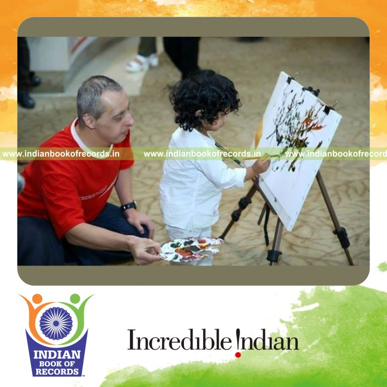 young girl creating longest painting artwork for Indian Book of Records