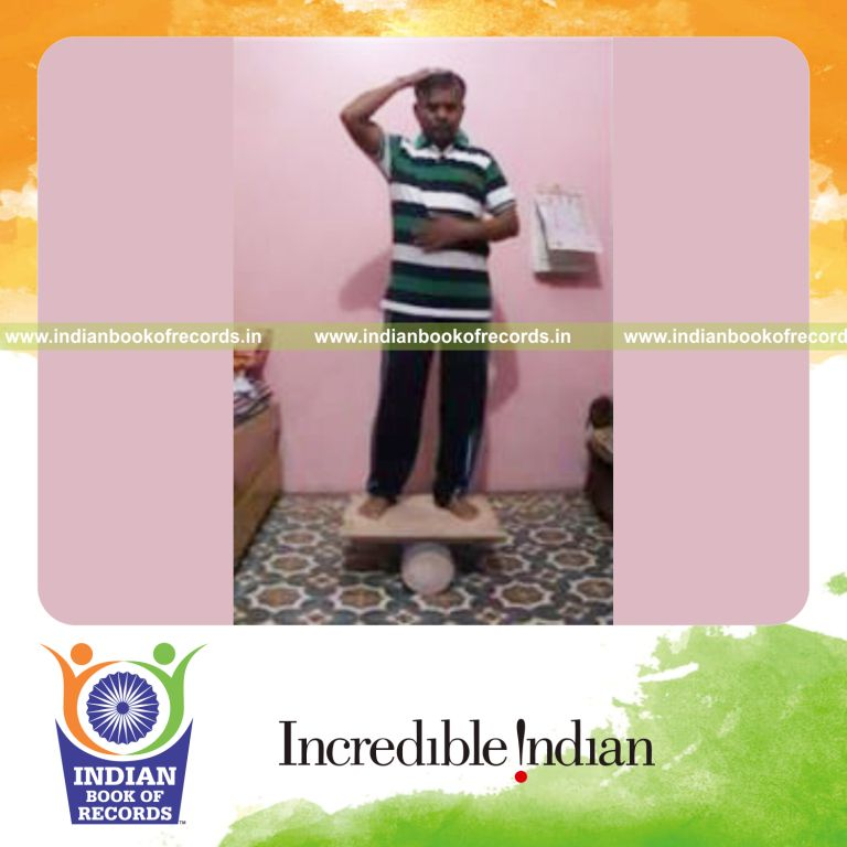 individual patting head and rubbing stomach on rola bola for record in Indian Book of Records