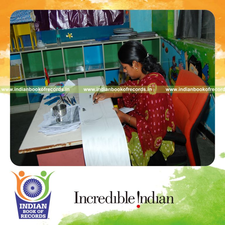 female individual creating extended pencil sketch artwork for record in Indian Book of Records