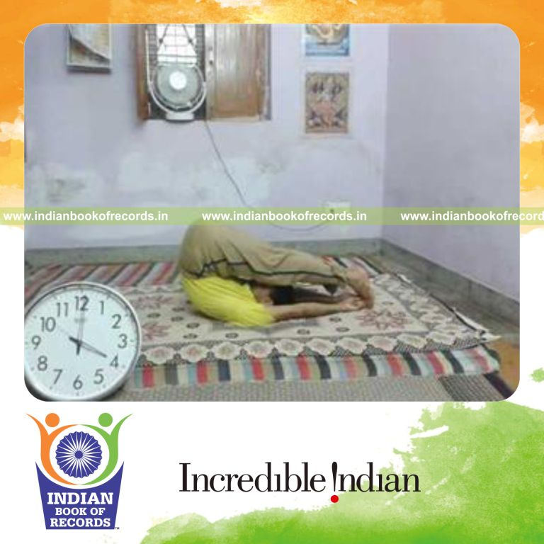 individual holding plow yoga pose for longest duration for record in Indian Book of Records