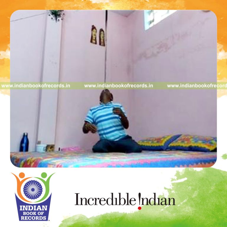 individual balancing pool cue on chin while kneeling for longest time for record in Indian Book of Records