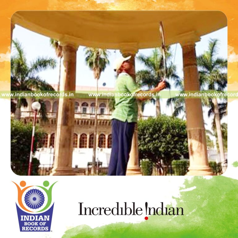 individual balancing tennis racquet on matchstick for record in Indian Book of Records