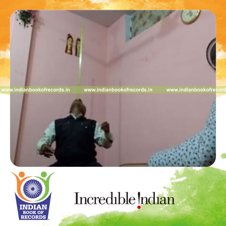 individual balancing three foot ruler on nose for record in Indian Book of Records