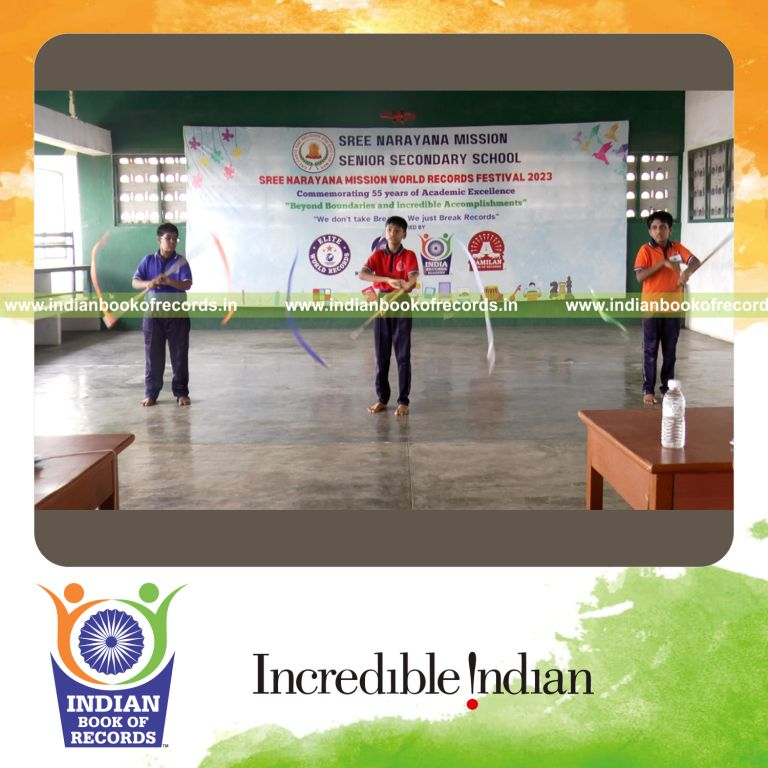 Team performing an extended Silambam relay sequence with continuous stick movements recognized by Indian Book of Records