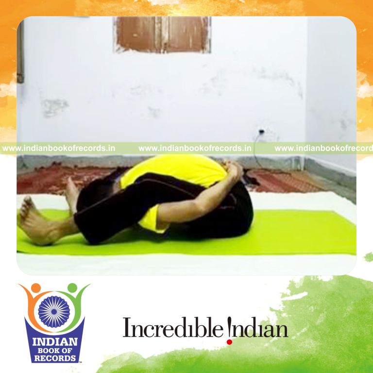 individual holding sleeping tortoise yoga pose for longest time for record in Indian Book of Records