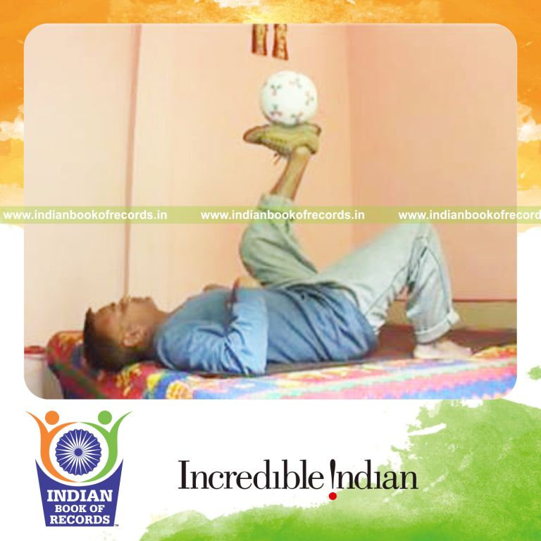 individual balancing soccer ball on sole of left foot for record in Indian Book of Records