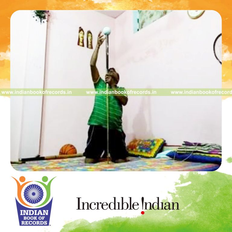 individual balancing softball on pool cue on hand for longest time for record in Indian Book of Records
