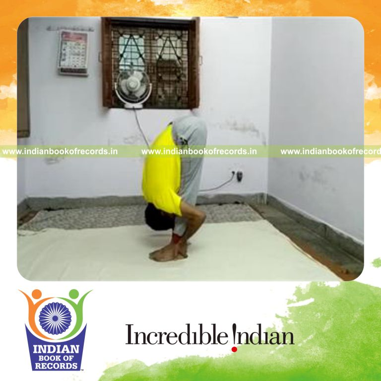 individual performing standing forward bend pose for longest time for record in Indian Book of Records