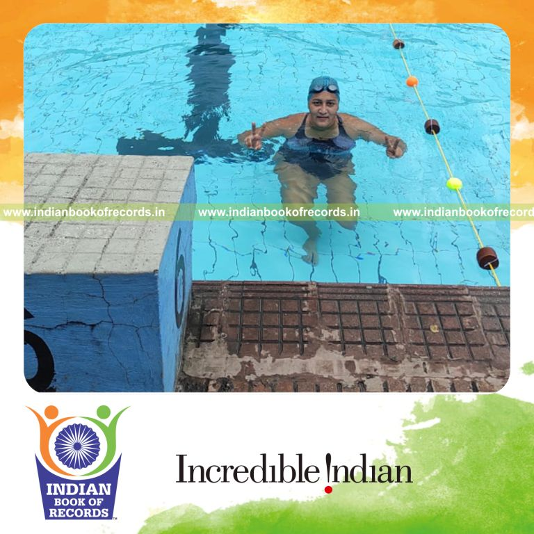 Woman swimming continuously over a long duration in a marathon effort recognized by Indian Book of Records
