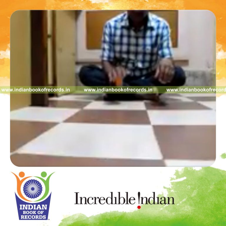 individual dribbling table tennis ball while holding easy pose for record in Indian Book of Records