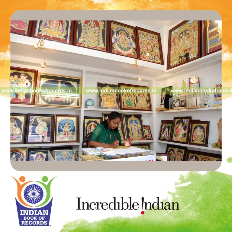 female individual creating tanjore paintings continuously for record in Indian Book of Records
