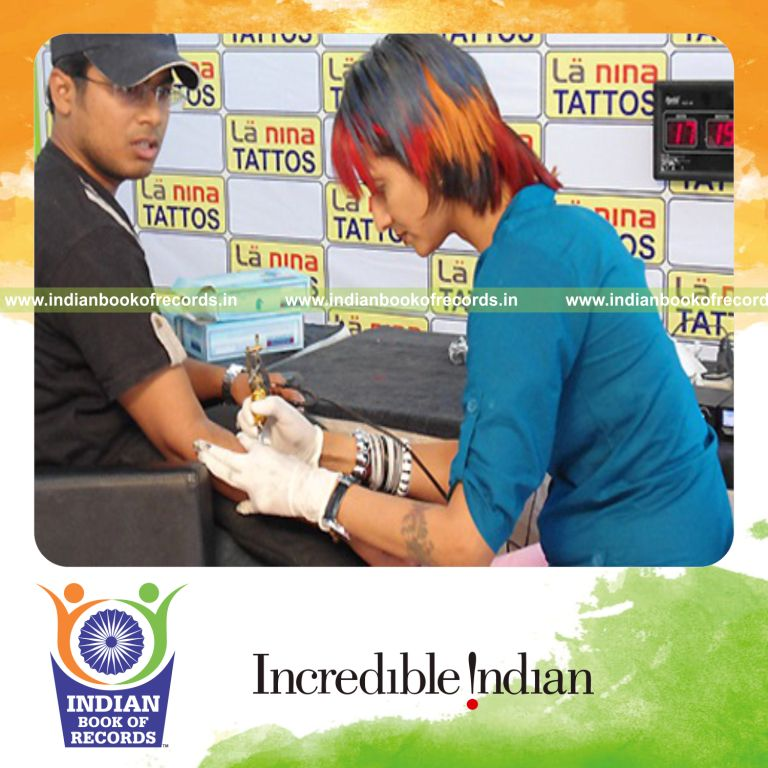 female individual performing tattoo marathon for extended duration for record in Indian Book of Records