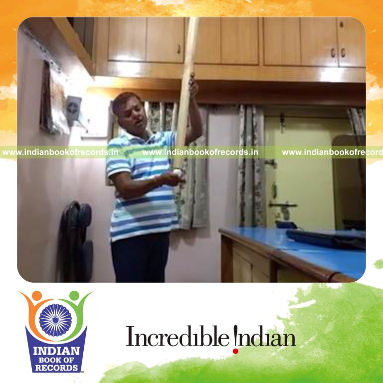 individual balancing wooden bar on golf ball held in hand for longest duration for record in Indian Book of Records