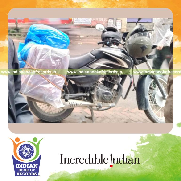 a rider completing a long distance motorcycle journey across India using minimum fuel consumption for a record in Indian Book of Records