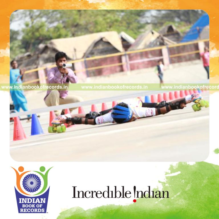male performing lowest limbo skating move for Indian Book of Records