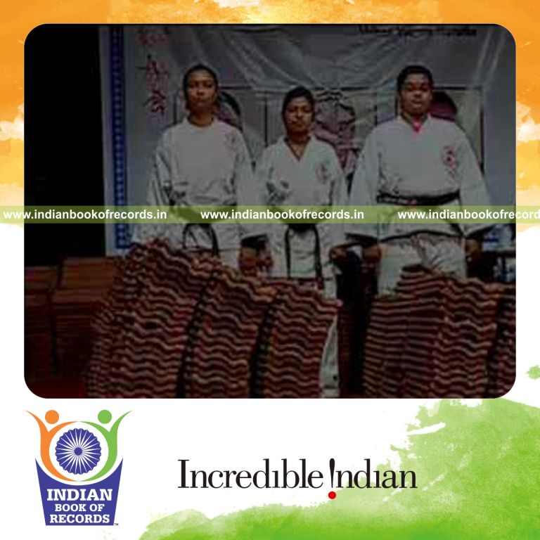 team breaking mangalore roof tiles on body for Indian Book of Records