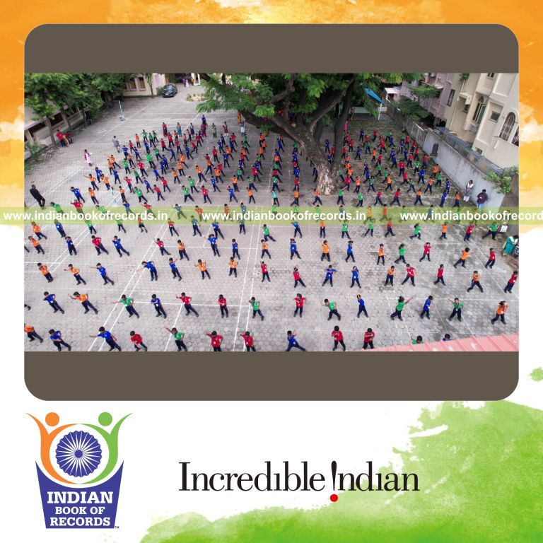 Large group of participants performing synchronized jazz dance together at one venue for Indian Book of Records