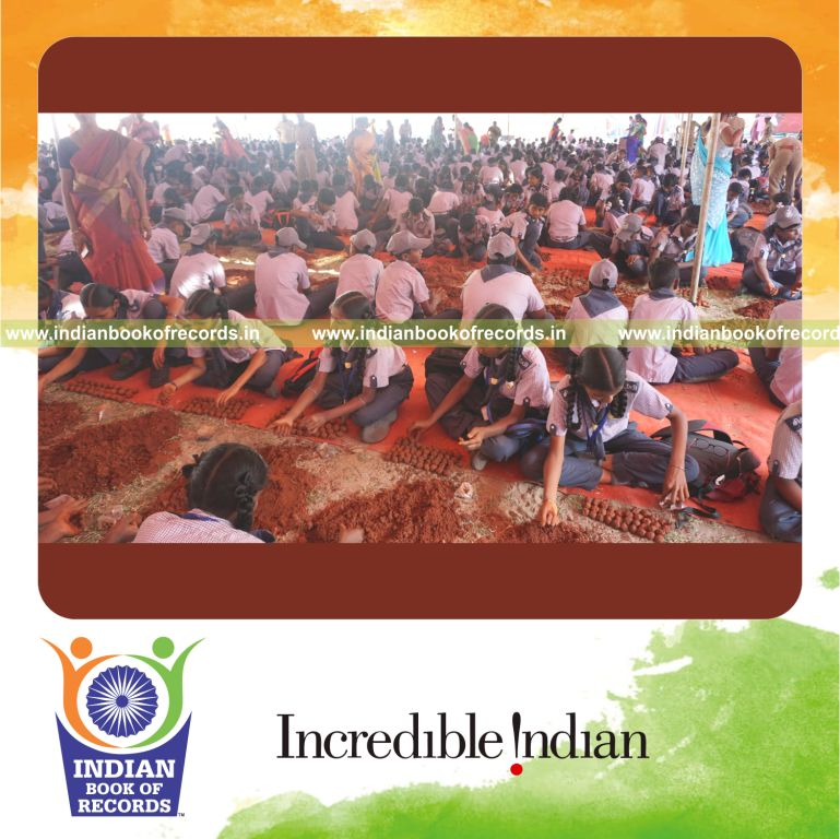 Participants working together to create seed balls rapidly within one hour for the Indian Book of Records