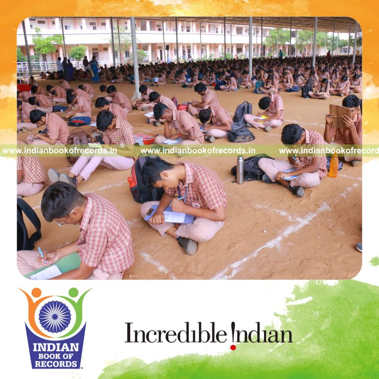 Large group working on math puzzles together simultaneously at a single venue for Indian Book of Records