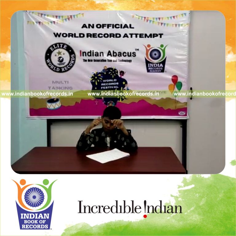 individual male solving addition problems 3 rows in 4 minutes for Indian Book of Records