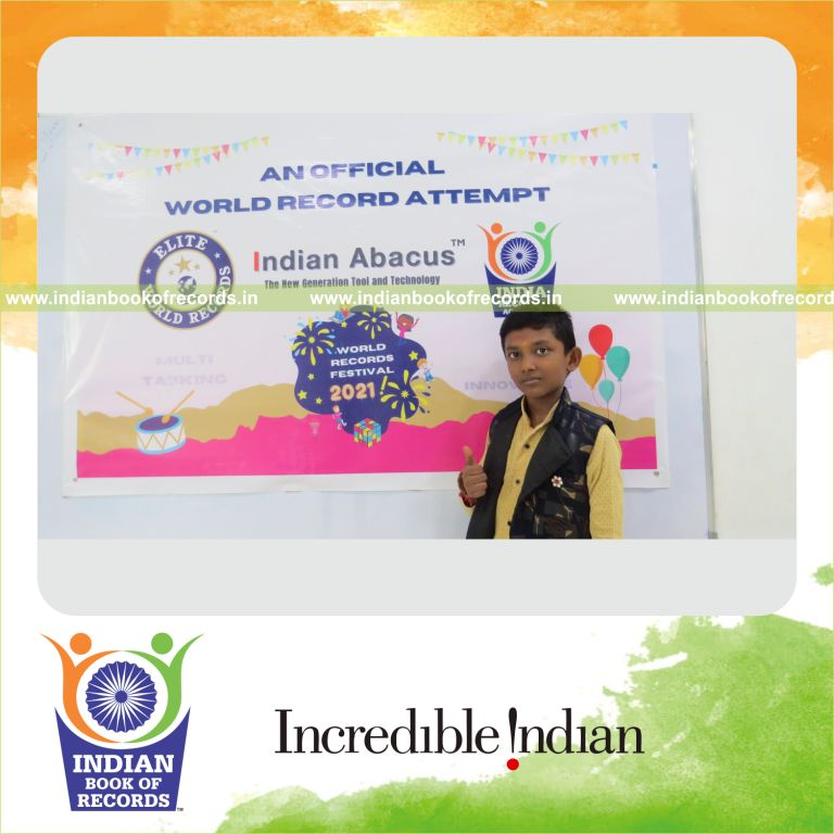 individual male solving addition problems while performing hula hoop simultaneously for Indian Book of Records