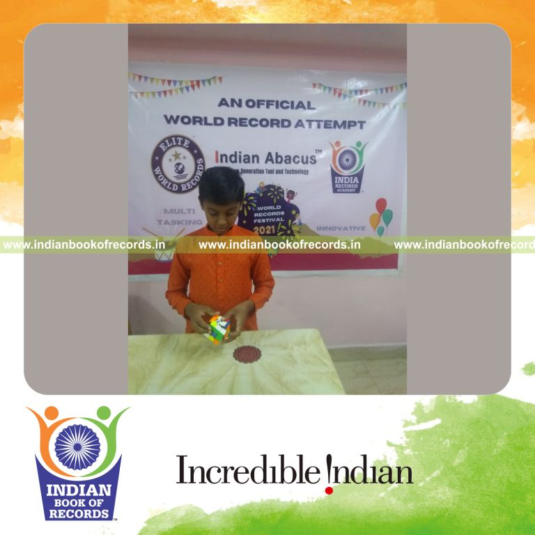 individual male solving mental arithmetic problems while solving rubik cube simultaneously for Indian Book of Records
