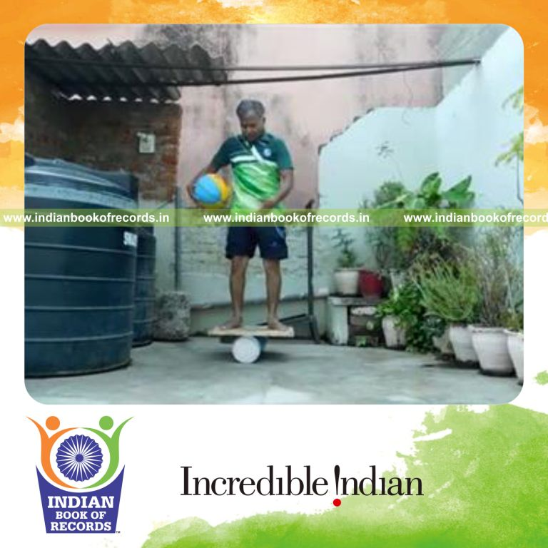 individual circling basketball around waist in 30 seconds while balancing on rola bola for record in Indian Book of Records