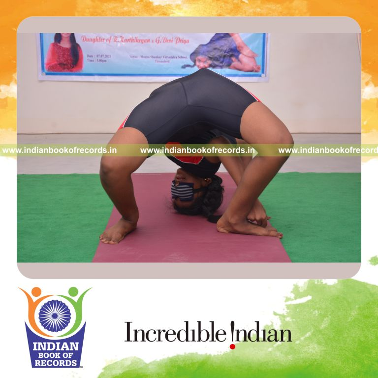 individual female performing maximum contortion poses blindfolded for Indian Book of Records