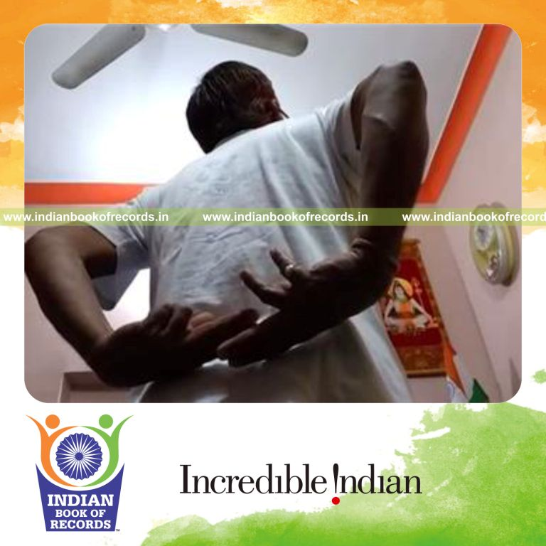individual performing finger scissors behind back in one minute for record in Indian Book of Records