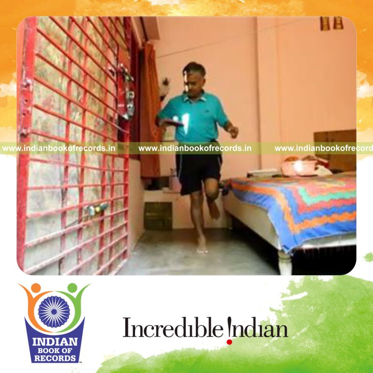 individual bouncing golf ball on alternate sides of paddle while hopping on one leg for record in Indian Book of Records