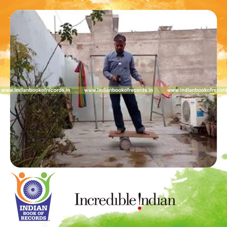 individual bouncing golf ball with rubber mallet while balancing on rola bola for record in Indian Book of Records
