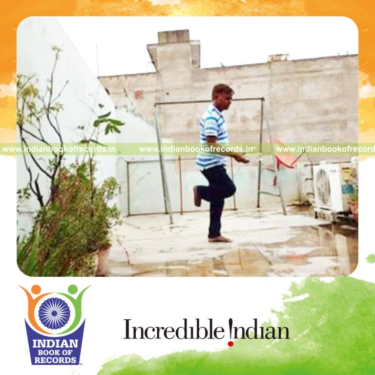 individual bouncing golf ball on wine bottle while standing on one leg for record in Indian Book of Records