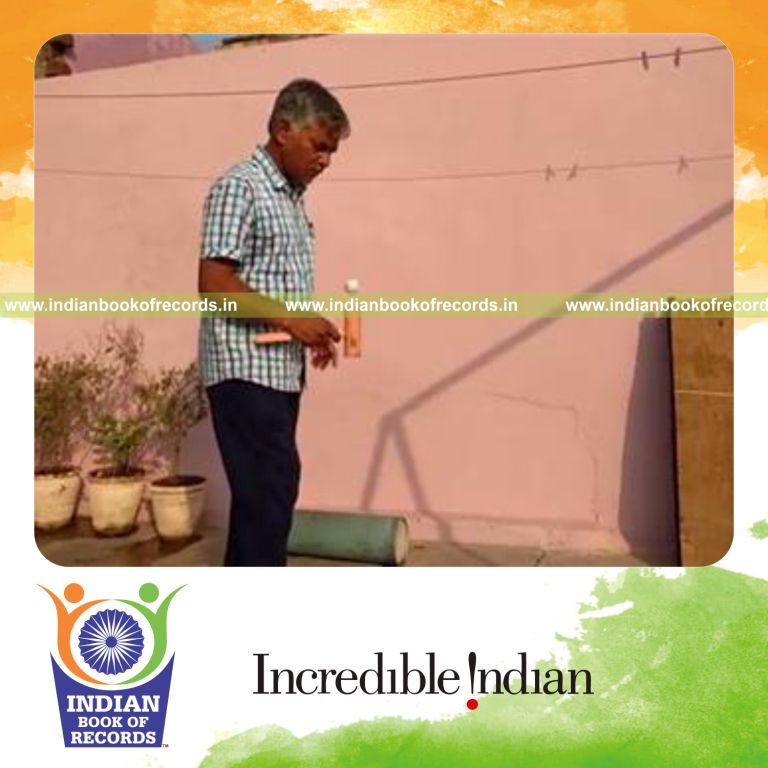 individual bouncing golf ball on wooden mallet for record in Indian Book of Records