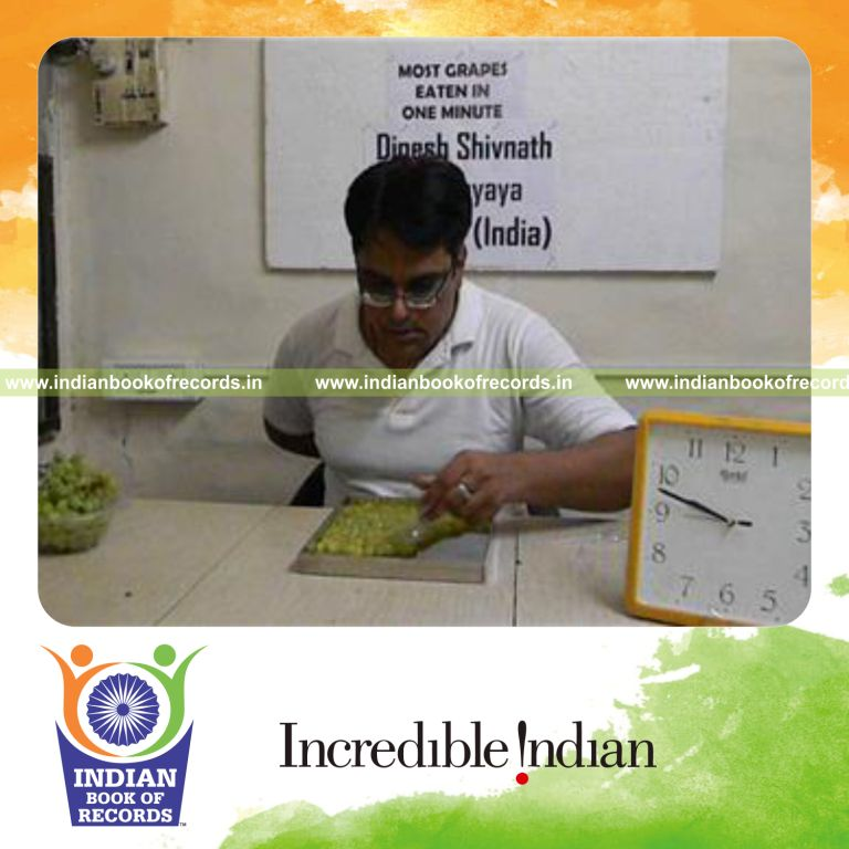 individual eating grapes using spoon in one minute for record in Indian Book of Records