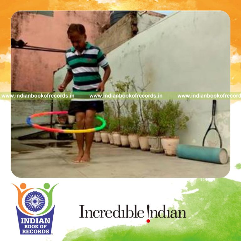 individual spinning hula hoop around legs in two minutes for record in Indian Book of Records
