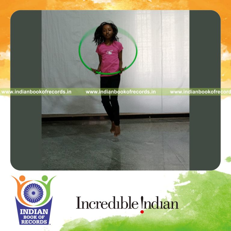 minor female performing maximum number of hula hoop skips for record in Indian Book of Records