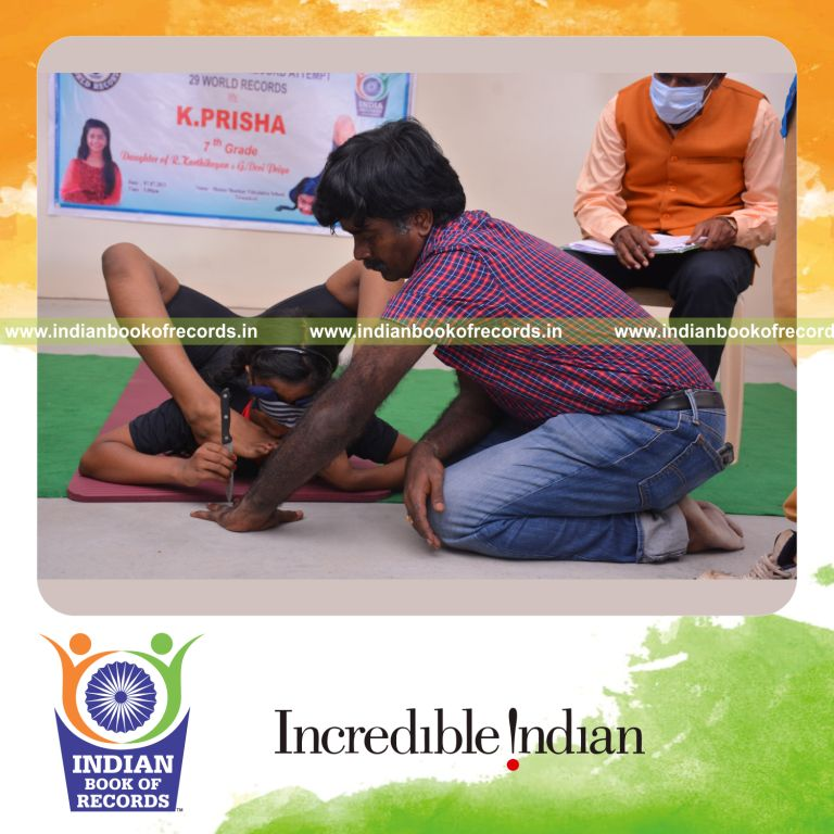 individual female performing knife stabs between another persons fingers while holding viparitha kanda perundasana blindfolded for Indian Book of Records